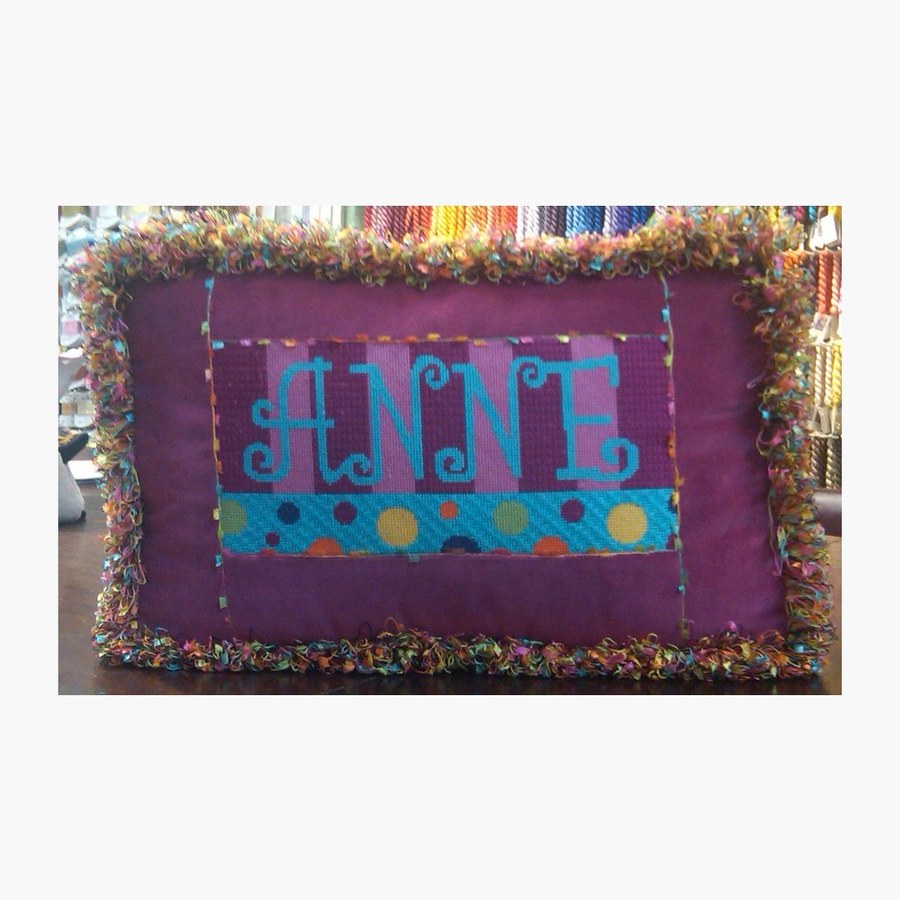 Finished monogram needlepoint pillow